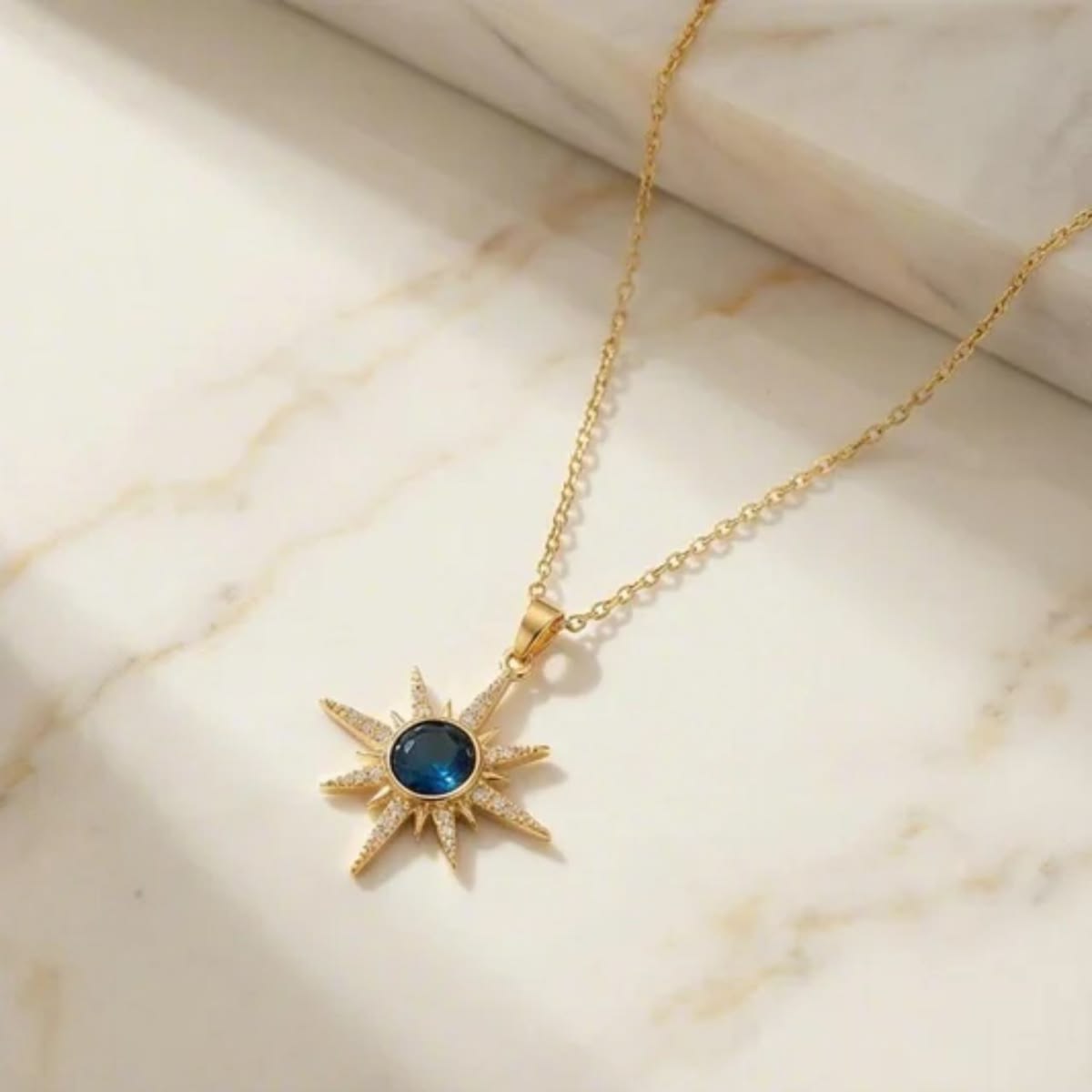 Gold Plated Starburst Pendant Necklace with Blue Crystal| Anyaura